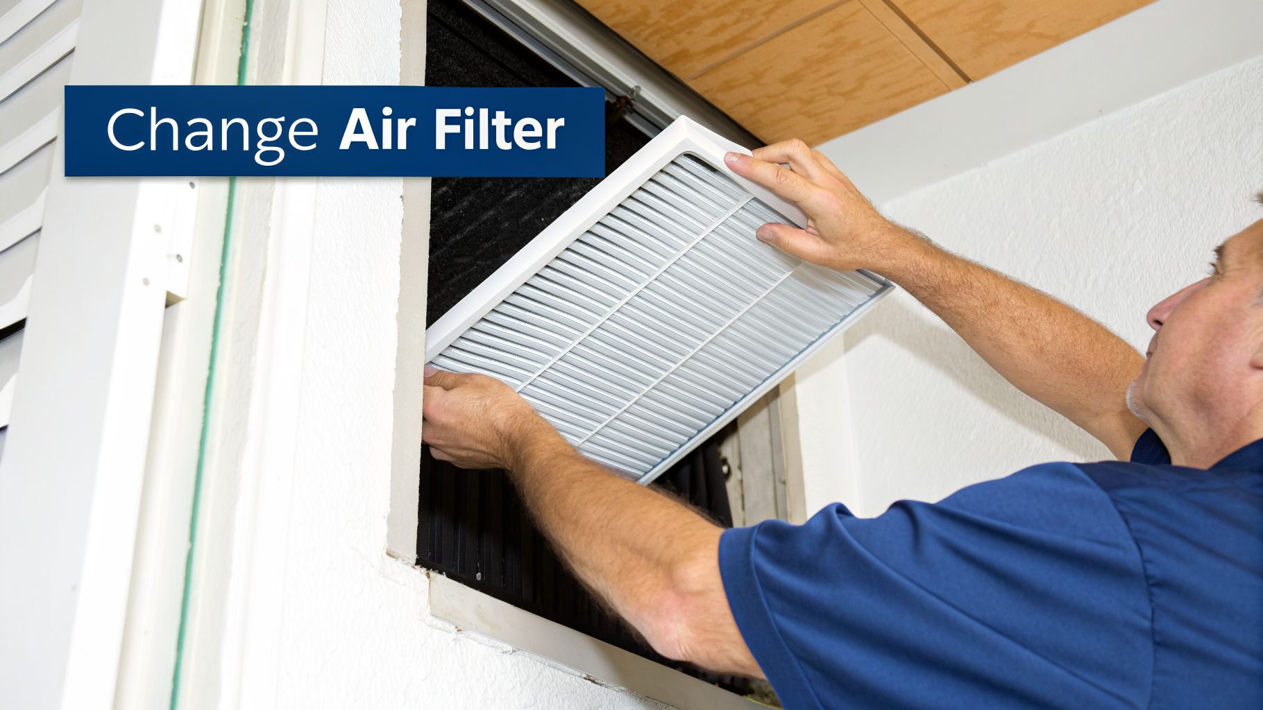 A man installing a new air filter into an HVAC system for improved home air quality.